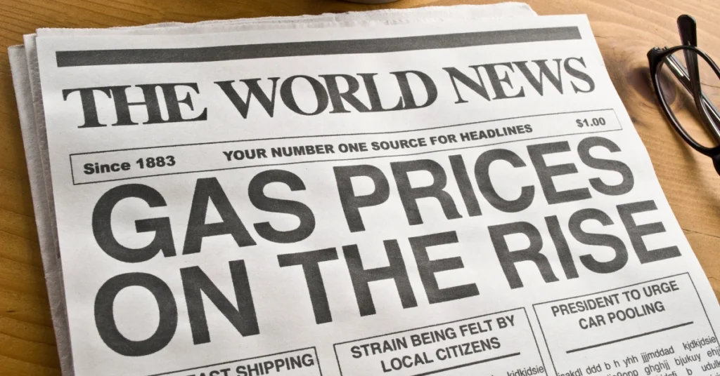 A newspaper headline reading "Gas Prices on the Rise," highlighting inflation impact on everyday essentials.